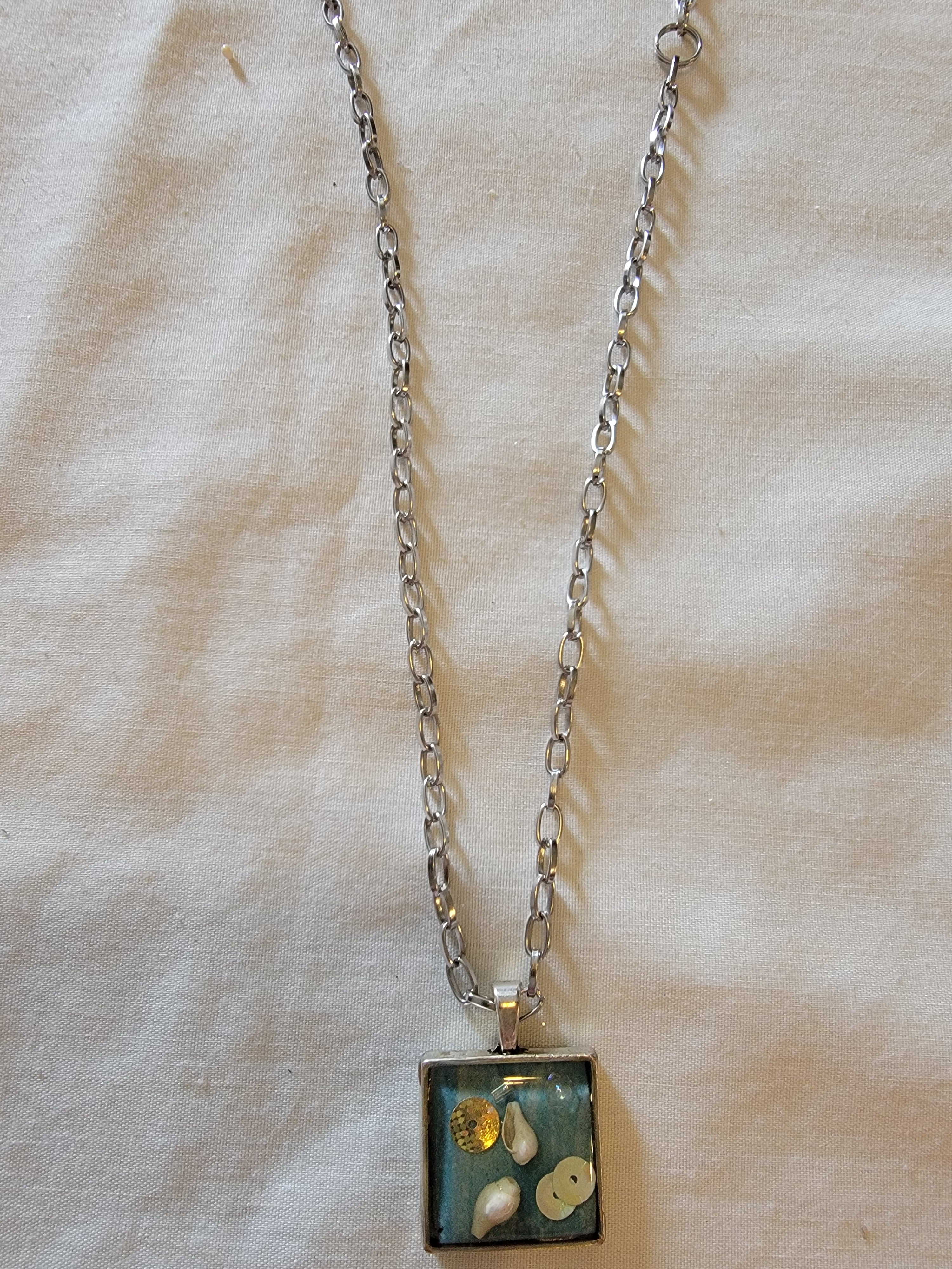 Square  blue necklace  with seashell