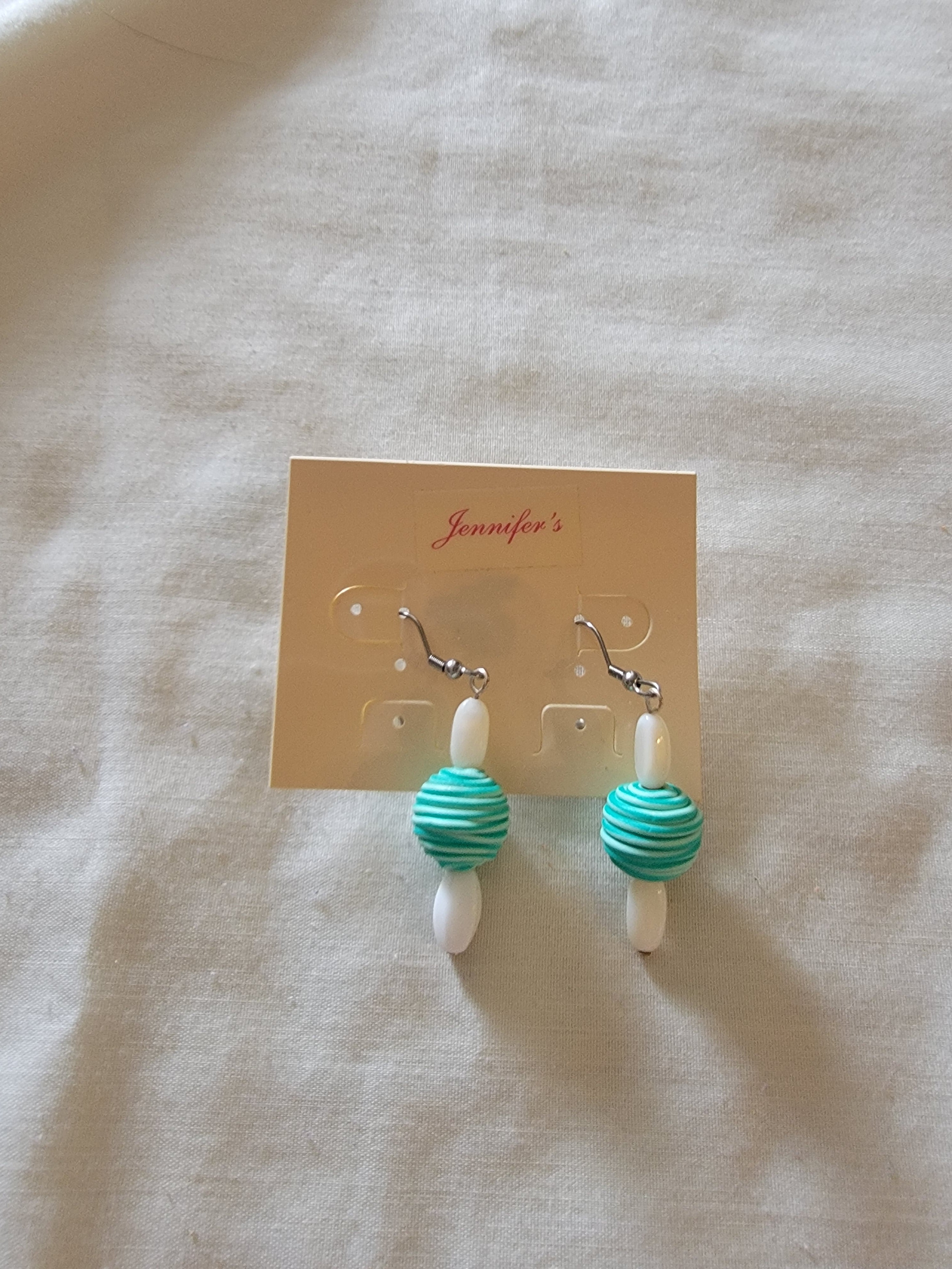 White and teal earrings