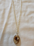 Brown Necklace  with some little seashell  in it